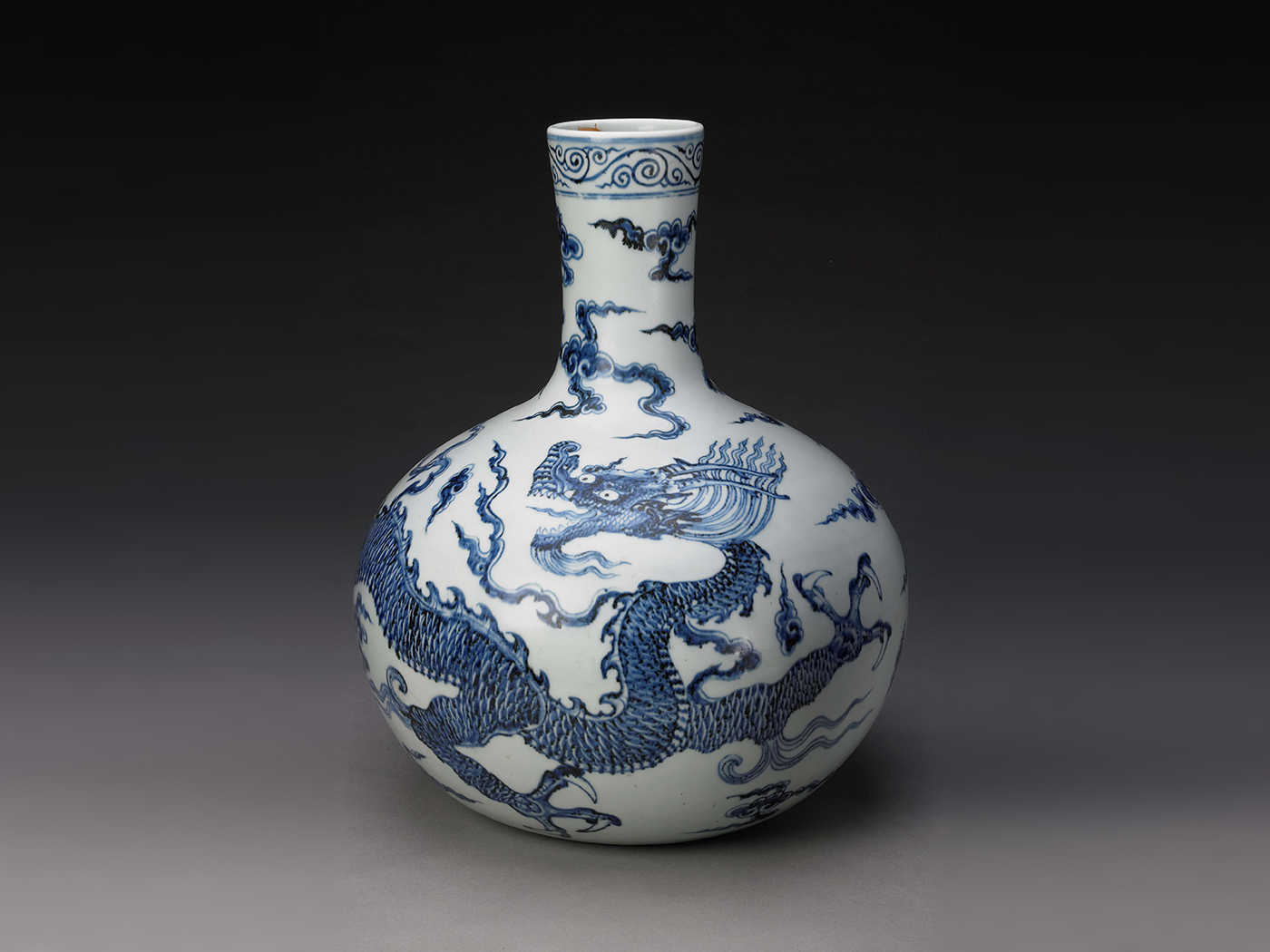 Globular vase with dragons among clouds